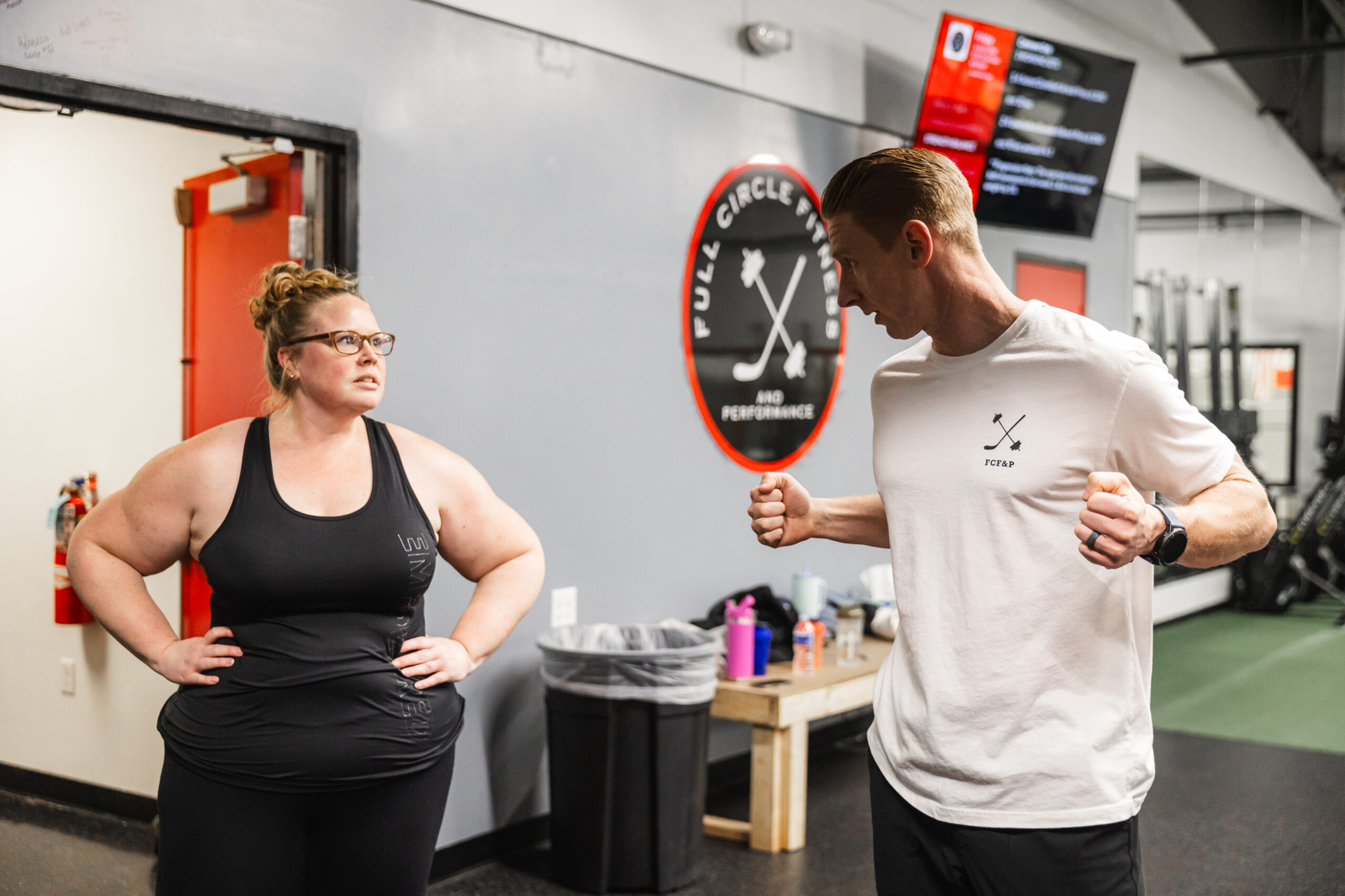 Coach Jeremiah Trostle training a member at Full Circle Fitness York PA
